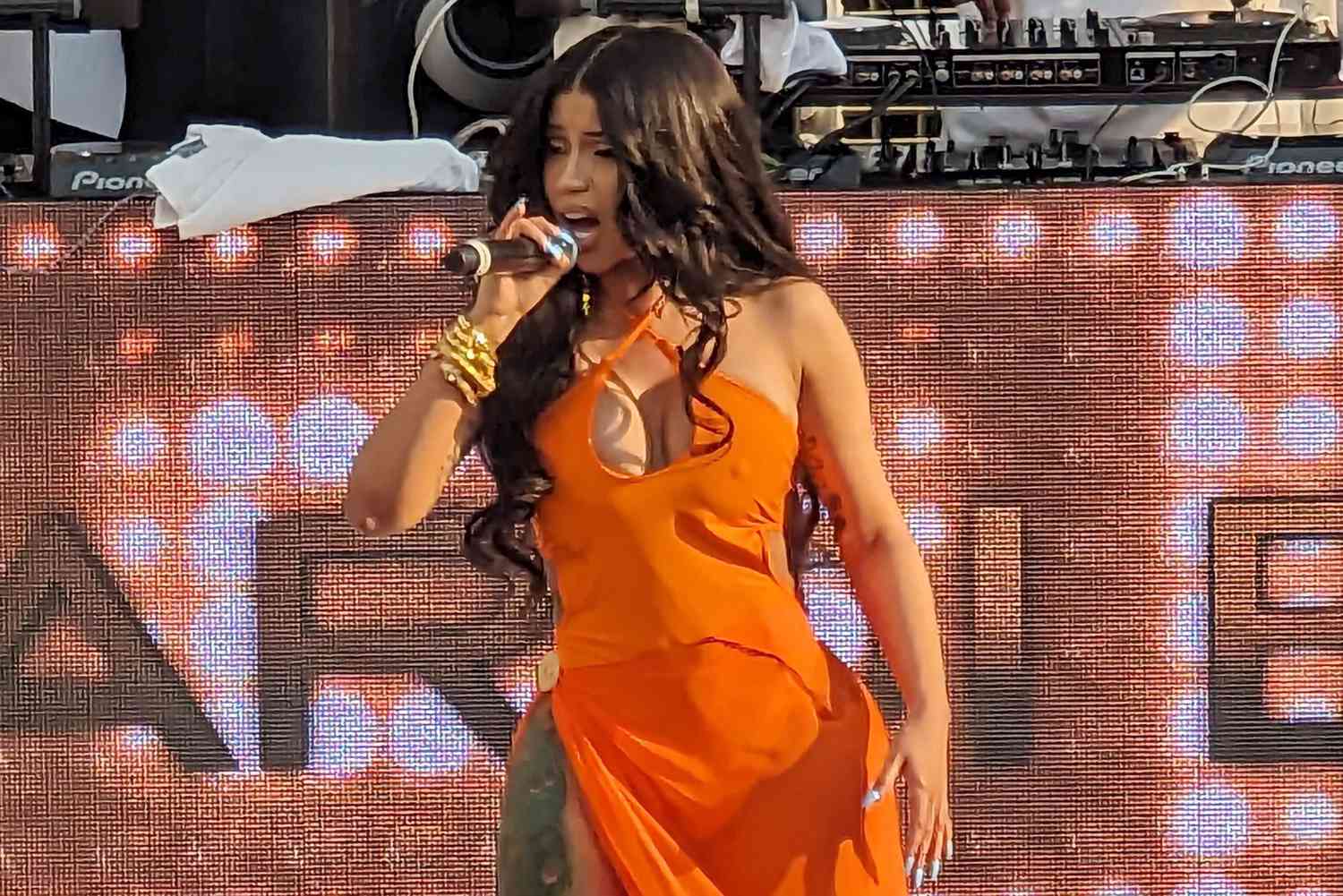 Cardi B tosses microphone at concertgoer who threw drink on her