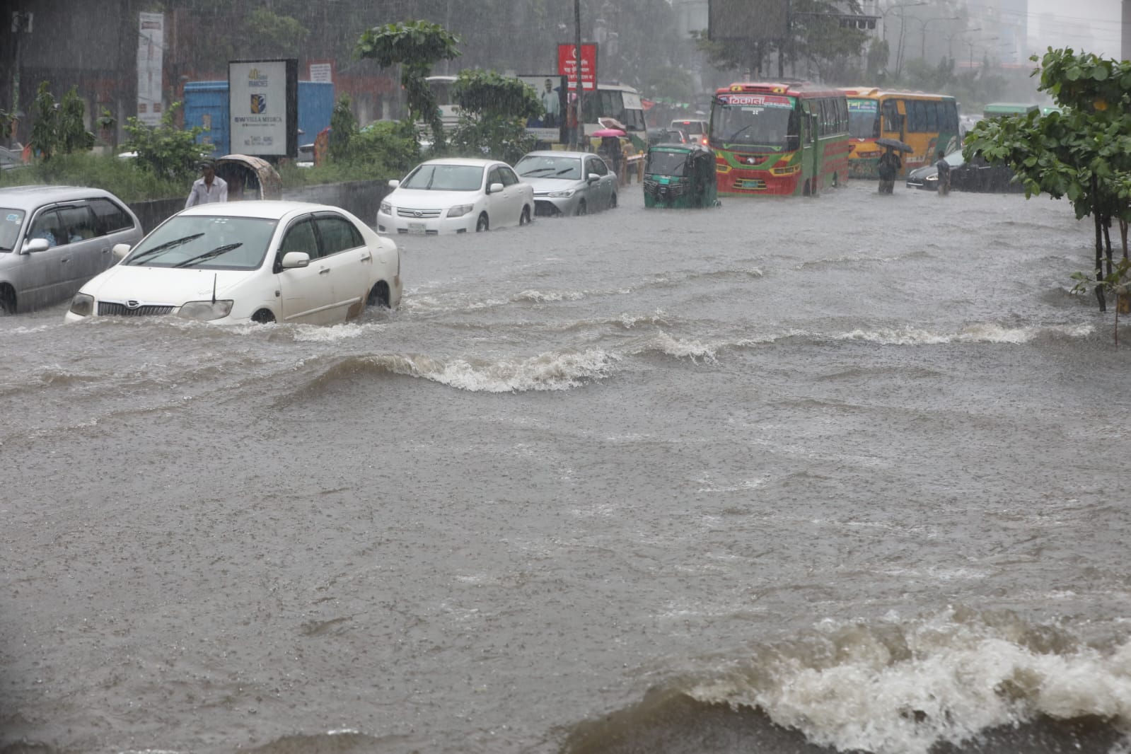 Vehicles navigate severe waterlogging in Dhaka, illustrating the modern reality of a metropolis that routinely goes under after a mere 30 to 40 millimetres of rain. Photo: Prabir Das