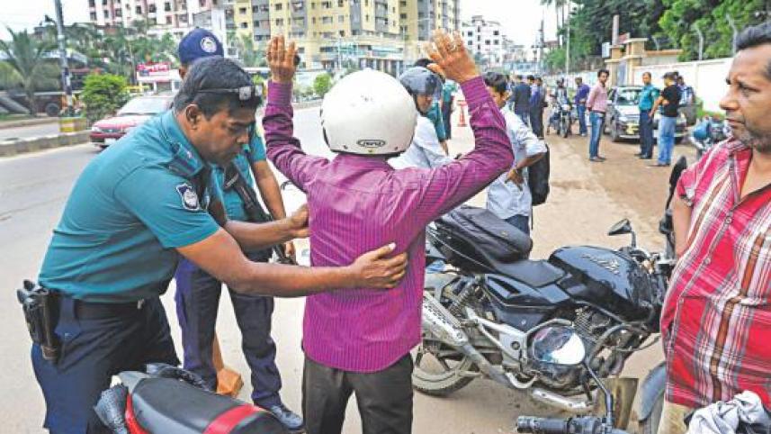 a_policeman_frisks_a_biker.jpg