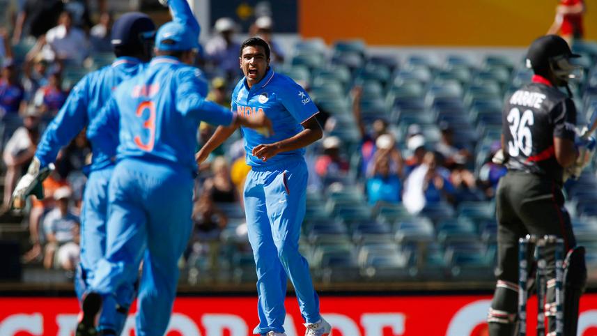 India's bowler Ravi Ashwin celebrates after Suresh Raina caught out United Arab Emirates' batsman Krishna Chandran 