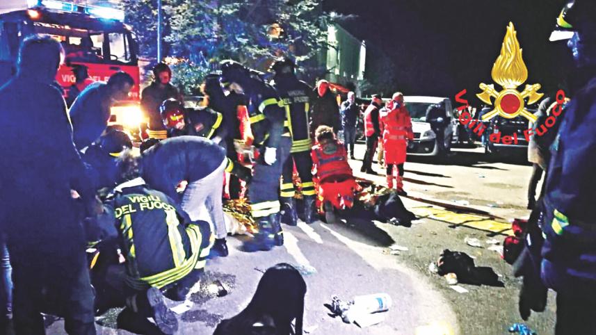 Emergency personnel treat victims.jpg