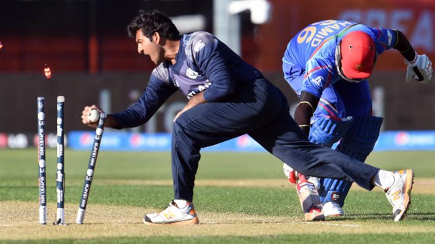 Scotland bowler Majid Haq attempts to run out 