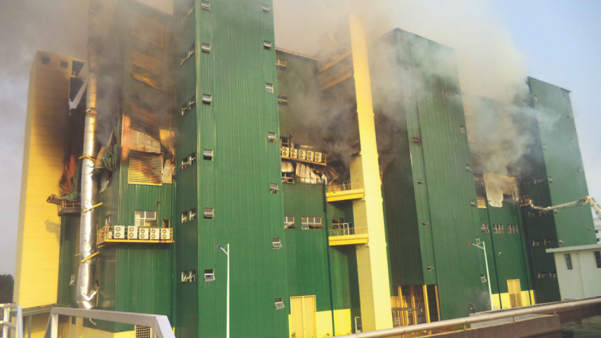 Smoke rises from a garment factory.jpg
