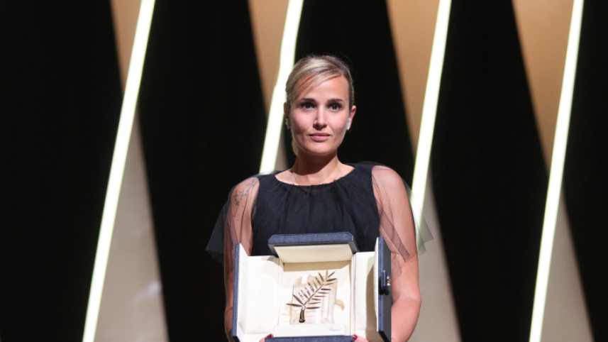 french_director_julia_ducournau_poses_on_stage_with_her_trophy_after_she_won_the_palme_dor_for_her_film_titane_at_the_74th_edition_of_the_cannes_film_festival_in_cannes_southern_france_on_july_17_2021.jpg