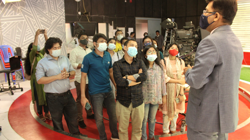 inner_1_a_news_presenter_at_channel_i_talks_to_fellows.jpeg