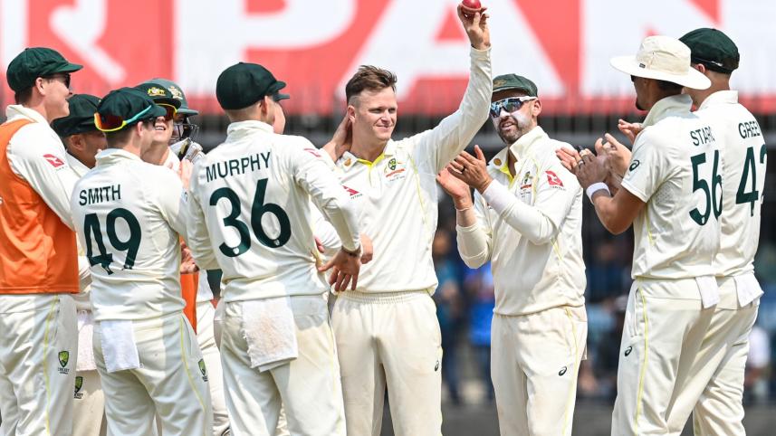 Australia's Matthew Kuhnemann celebrates with teammates during the first day of the third Test against India at the Holkar Stadium in Indore on March 1, 2023. PHOTO: AFP