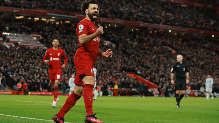 Virgil van Dijk and forward Mohamed Salah scored second-half goals as Liverpool battled to a 2-0 Premier League home win over Wolverhampton Wanderer