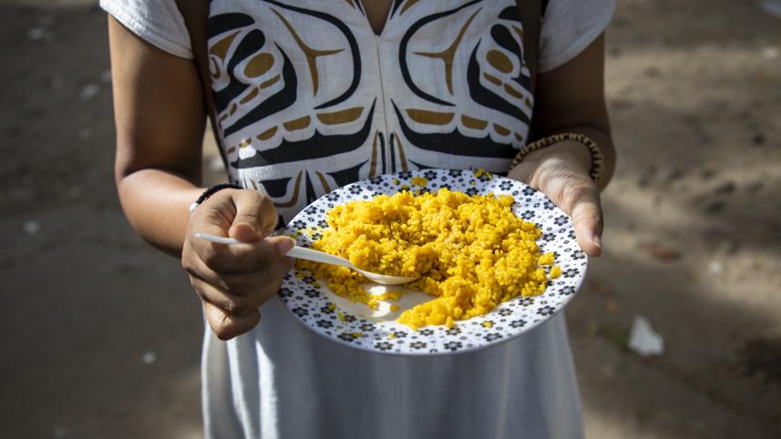 Person having a plate of khichuri. 