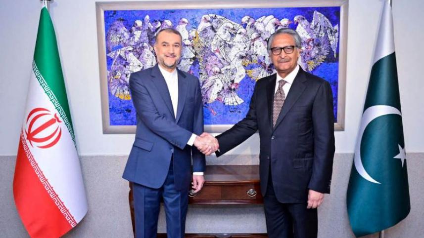 Pakistan’s caretaker Foreign Minister Jalil Jilani shakes hands with Iran’s Foreign Minister Hossein Amir-Abdollahian in Islamabad, January 29, 2024. 