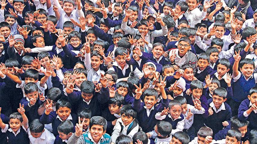 A crowd of school children celebrating