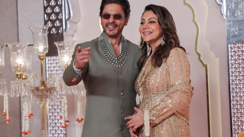 shah_rukh_khan_and_his_wife_gauri_khan_pose_for_pictures_on_the_red_carpet_on_the_day_of_the_wedding_of_anant_ambani_and_radhika_merchant_in_mumbai_india.jpg