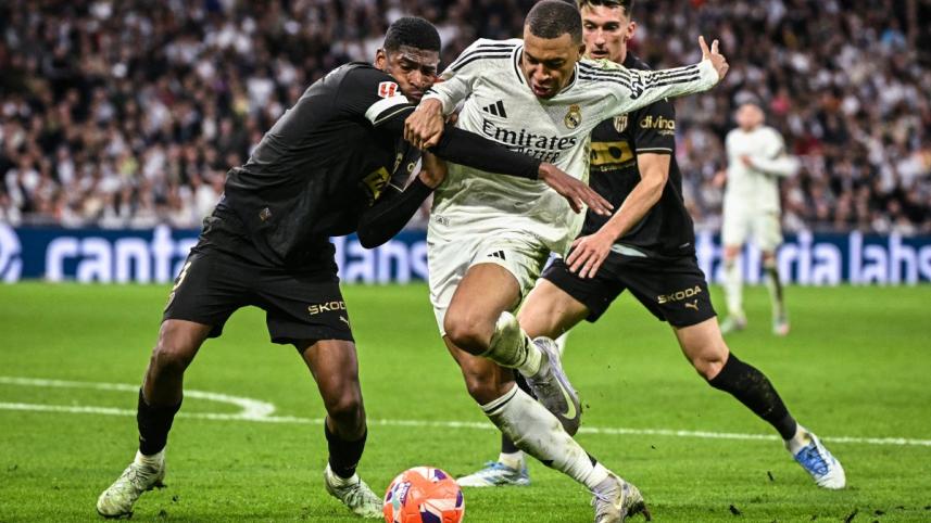 afp_20250405_399p2zy_v4_preview_topshotfblespligarealmadridvalencia.jpg