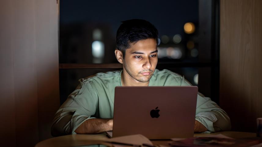 A young professional working late into the night