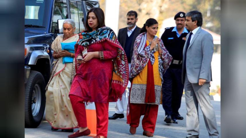 Former Indian navy officer Kulbhushan Sudhir Jadhav's mother Avanti (L) and wife, Chetankul, (3rd R) 