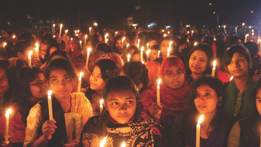 women-hold-lighted-candles.jpg