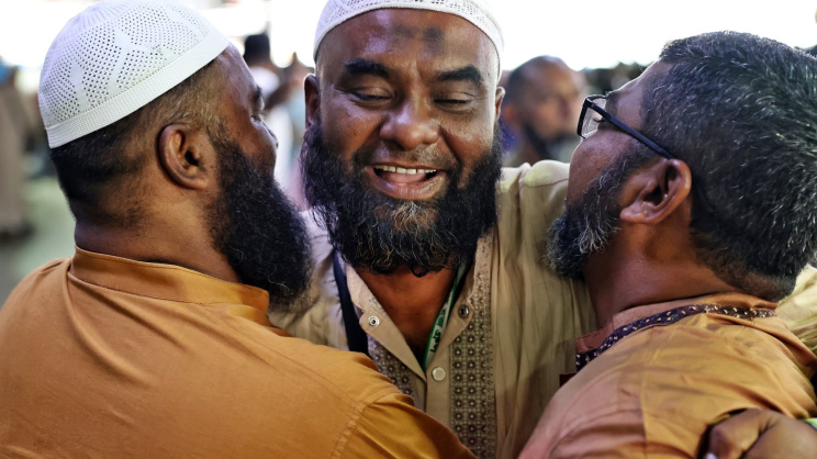 A returning Hajj pilgrim embraces loved ones after arriving at Hazrat Shahjalal International Airport, marking an emotional reunion following the pilgrimage to Saudi Arabia. Photo: Star