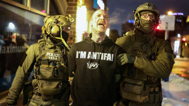 AFP__20260205__969Y9FF__v4__MidRes__TopshotUsImmigrationIceShooting.jpg