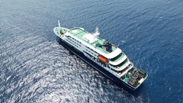 This aerial picture shows a general view of the cruise ship MV Hondius stationary off the port of Praia, the capital of Cape Verde, on May 4, 2026. AFP 