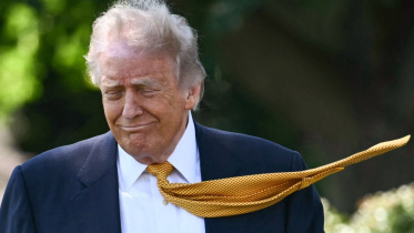 US President Donald Trump walks to speak to the press before boarding Marine One on the South Lawn of the White House in Washington, DC on May 12, 2026. Photo: AFP