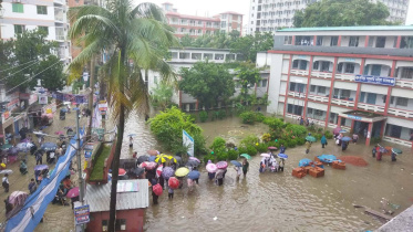 Outside Cumilla Government Women's College in Chartha, several female candidates crossed flooded roads in plastic boats before sitting for their examinations in wet clothes. Photo: Collected