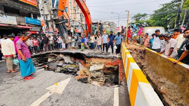 The road near the median collapsed around 3:00pm yesterday during heavy rain. Photo: Star