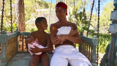 Cristiano with twins.JPG