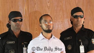 Rapid Action Battalion members produce the prime suspect Shafiur Rahman Farabi in writer Avijit Roy’s murder case before reporters at its Uttara headquarters in the capital on March 2, 2015. He was arrested earlier in the day. Photo: STAR