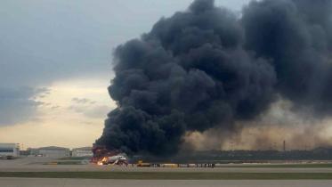 plane catches fire.jpg
