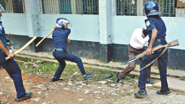 police beating teacher.jpg