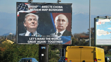 A billboard showing US President-elect Donald Trump and Russian President Vladimir Putin