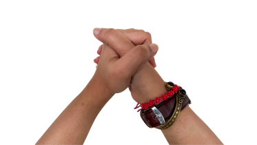 A photo of a pair of hands signing the word "friend"