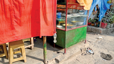 Tong veiled behind a red curtain.