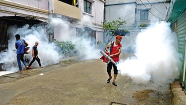 Workers of Dhaka North City Corporation using fogger machines to kill off Aedes mosquitoes in a bid to curb the spread of dengue in the capital’s Lalmatia. 