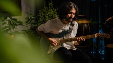 A person playing the guitar