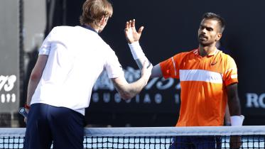 India's Sumit Nagal shakes hands with Kazakhstan's Alexander Bublik after winning his first round match. 