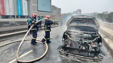 Car catches fire on flyover near airport