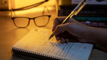 A person taking notes