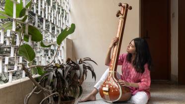 Musician playing the Sitar.