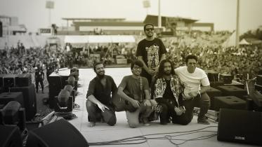 Kaaktaal posing for a photo on the stage