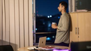 A young professional working late into the night