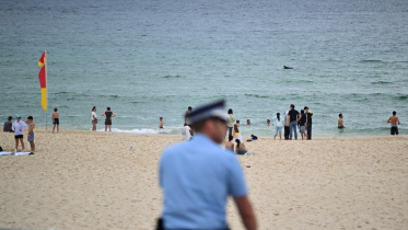 afp_20251222_88th39v_v1_midres_australiaattackbondi.jpg