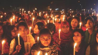 women-hold-lighted-candles.jpg