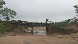 A bridge connecting the Kapai and Laskarpur tea gardens in Chunarughat upazila of Habiganj collapsed following an overnight landslide on Sunday. Photo: Star
