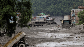 Mud covers houses and a road following a flash flood at Trishuli in Nuwakot district, Nepal, August 26. REUTERS/Navesh Chitrakar