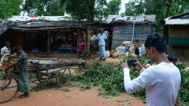 Rohingya youth taking photos.jpg