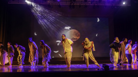 A group of performers performing on stage