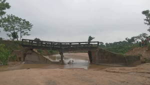 A bridge connecting the Kapai and Laskarpur tea gardens in Chunarughat upazila of Habiganj collapsed following an overnight landslide on Sunday. Photo: Star