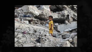A Palestinian child stands on the rubble of a destroyed building near the Shati refugee camp in western Gaza City AFP (2).png