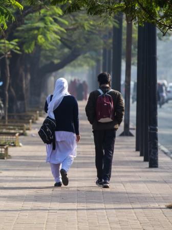Two students walking side by side 