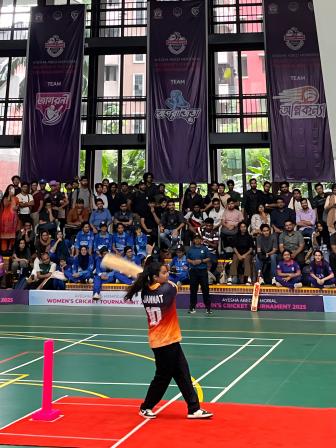 Athlete batting in a game of cricket.